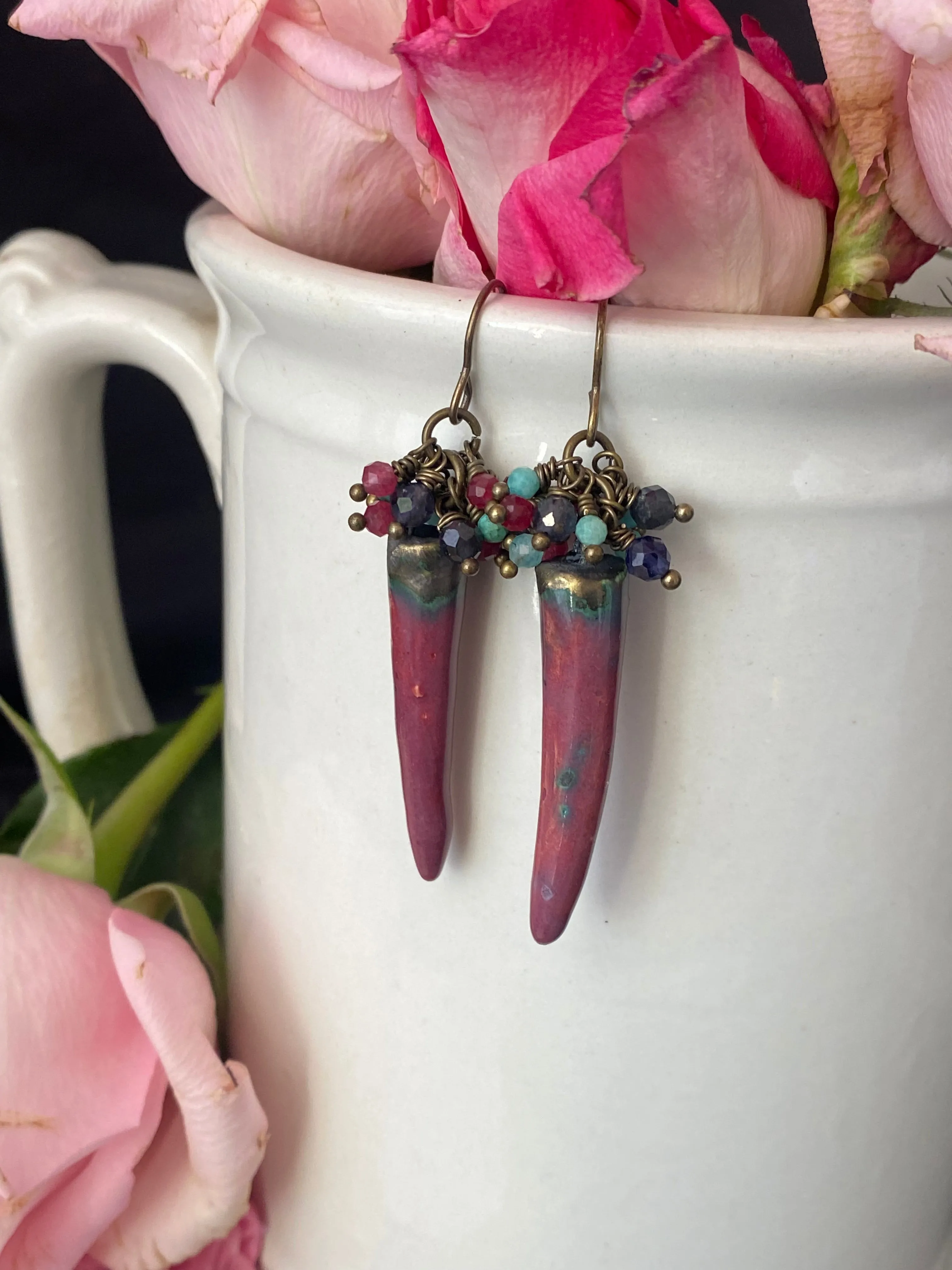 Mixed gemstones, handmade ceramic charms, bronze metal, earrings. Ruby, blue and amazonite